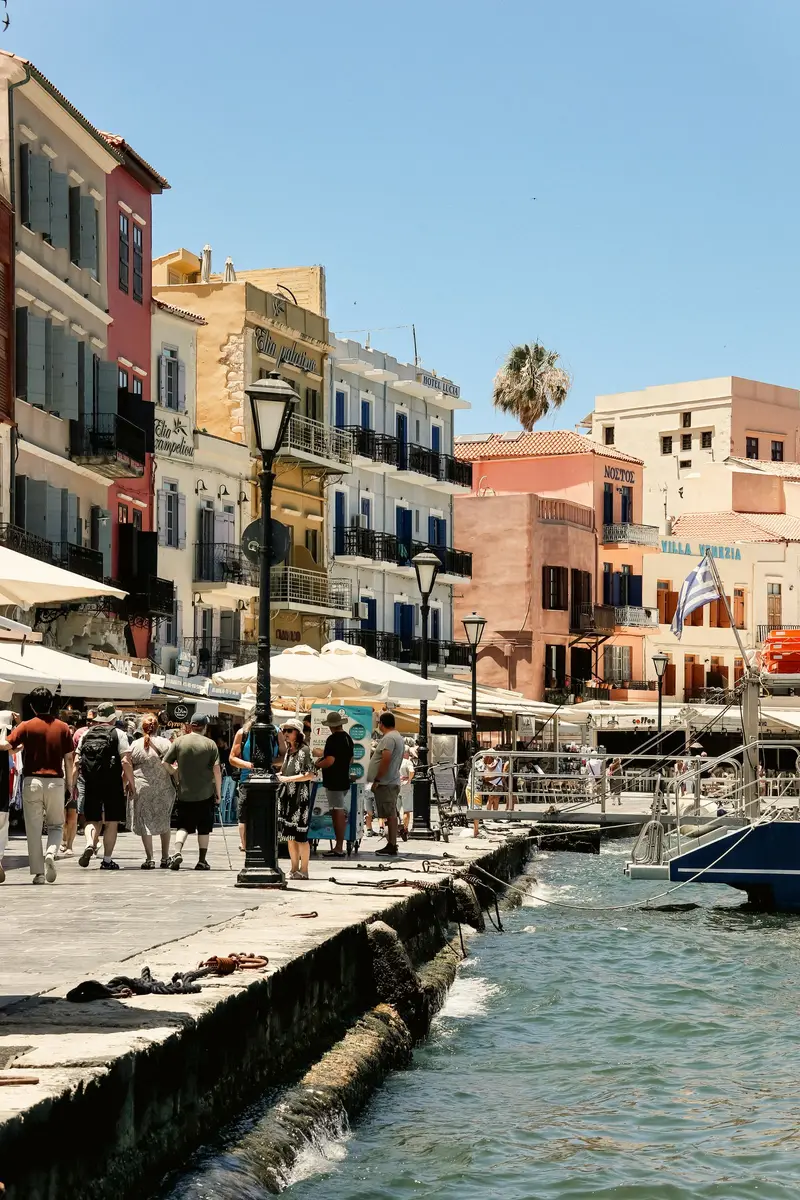 People along the Chania waterfront